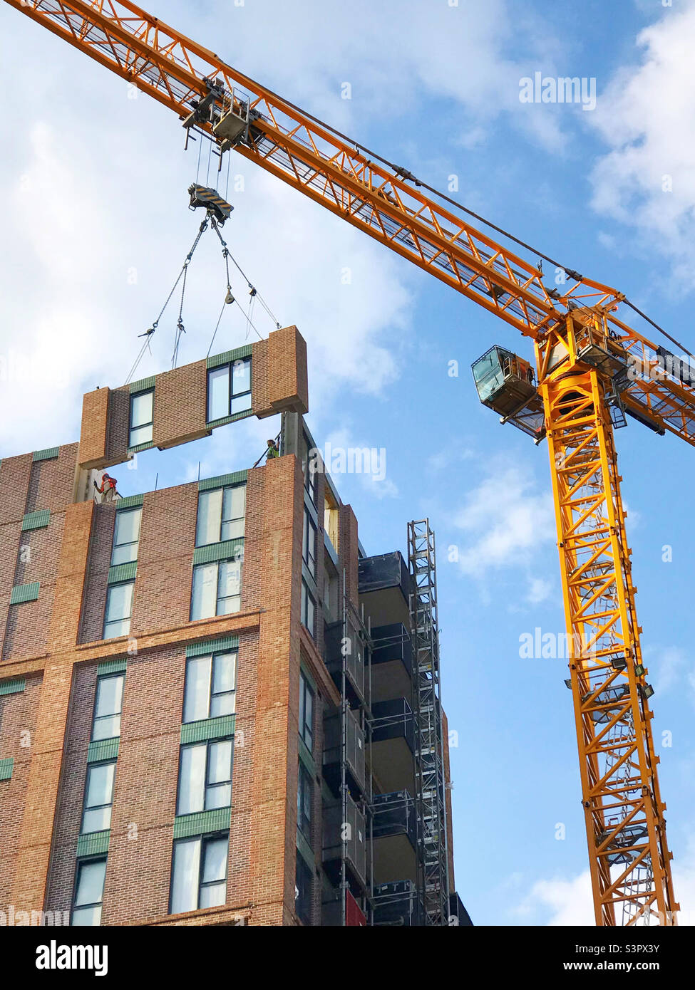 A luxury block of flats having a prefabricated wall craned into place in Bristol Stock Photo