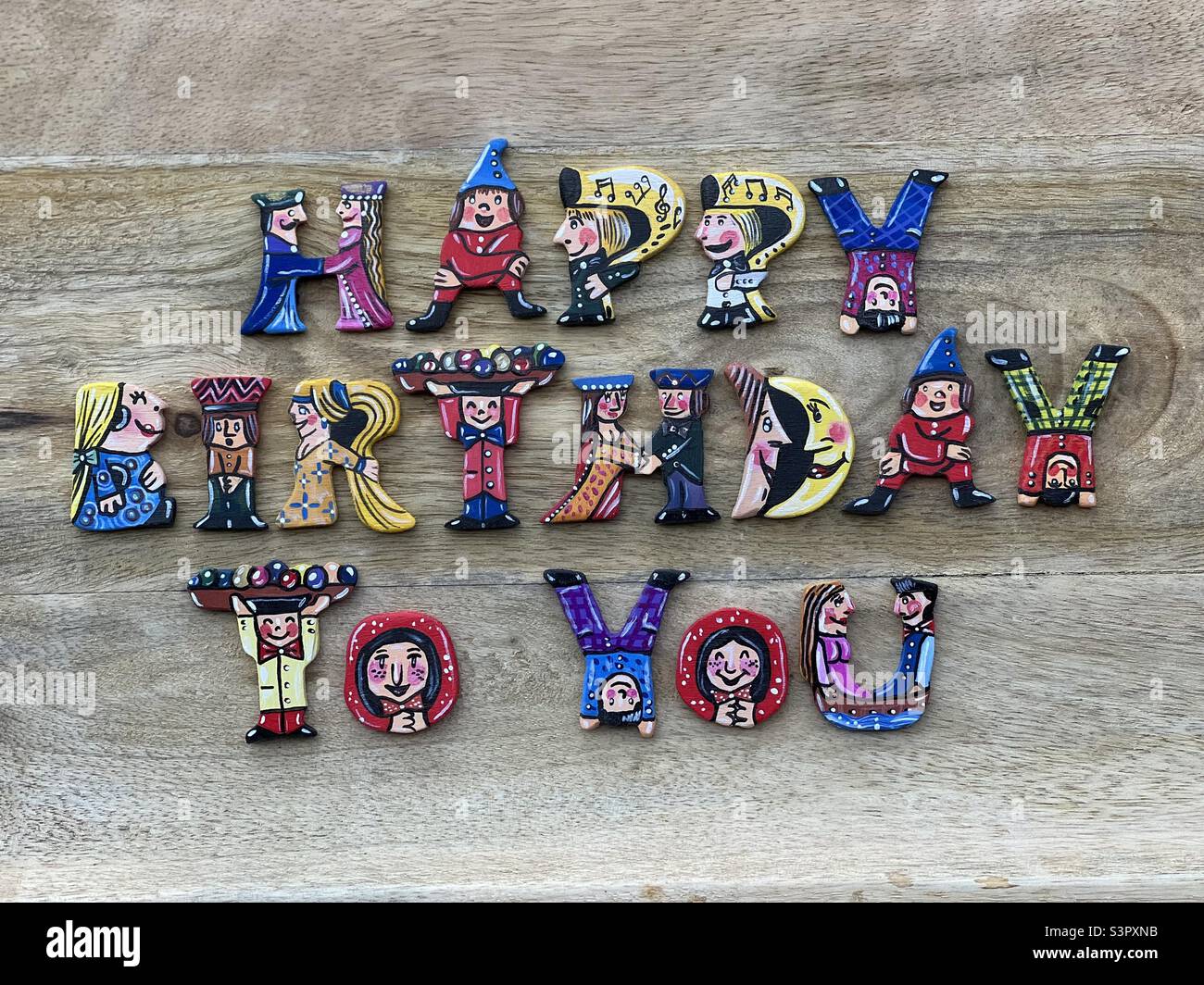 Happy Birthday to you text composed with hand painted creative hand painted wooden letters Stock Photo