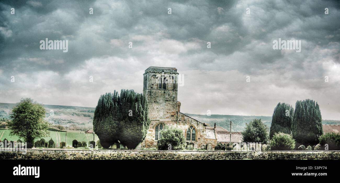 Church with moody clouds Stock Photo
