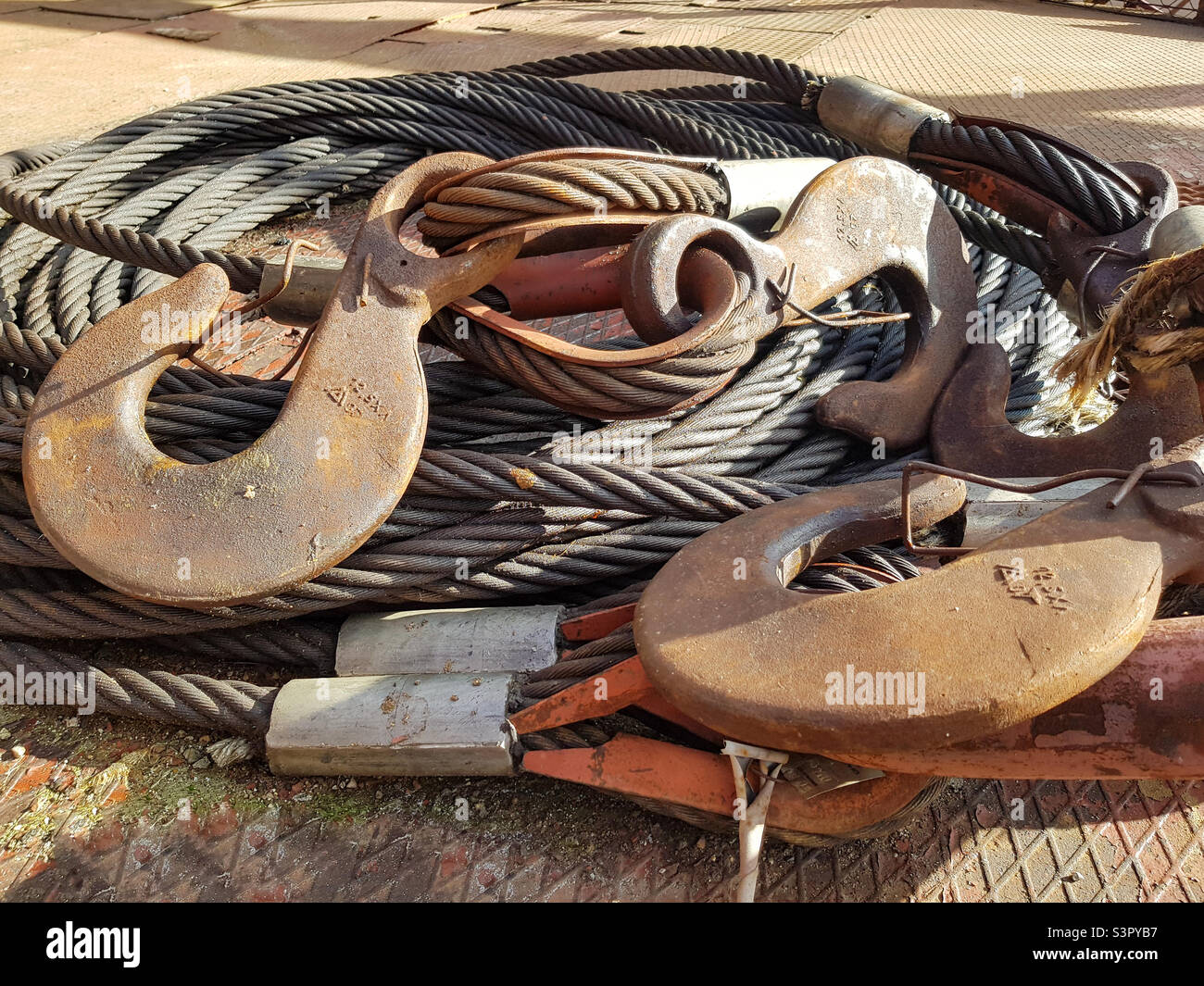 Chain hook of the tower crane for lifting cargo closeup. Rope slings