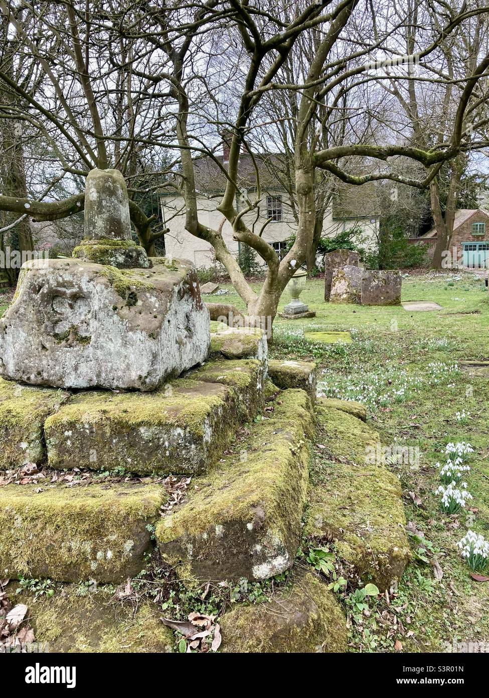 Headless cross in church yard Stock Photo Alamy