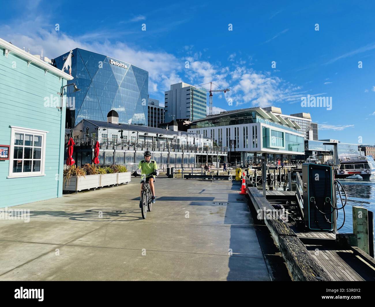 Cyclist rides along Wellington waterfront - Smartphone Captured Stock Image