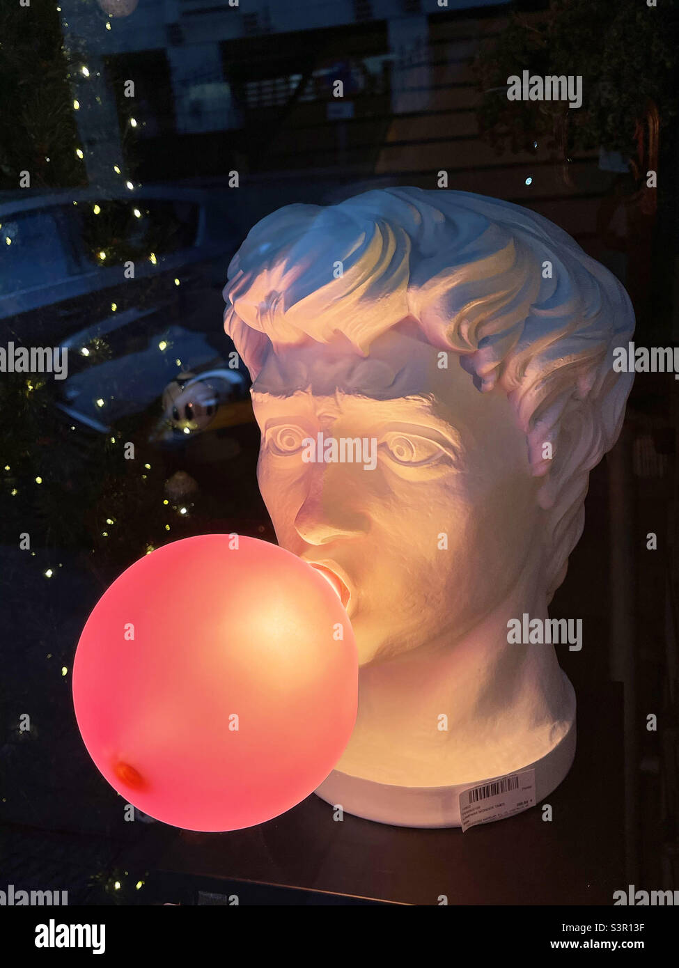 Sculpture blowing up a red glove - Smartphone Captured Stock Image