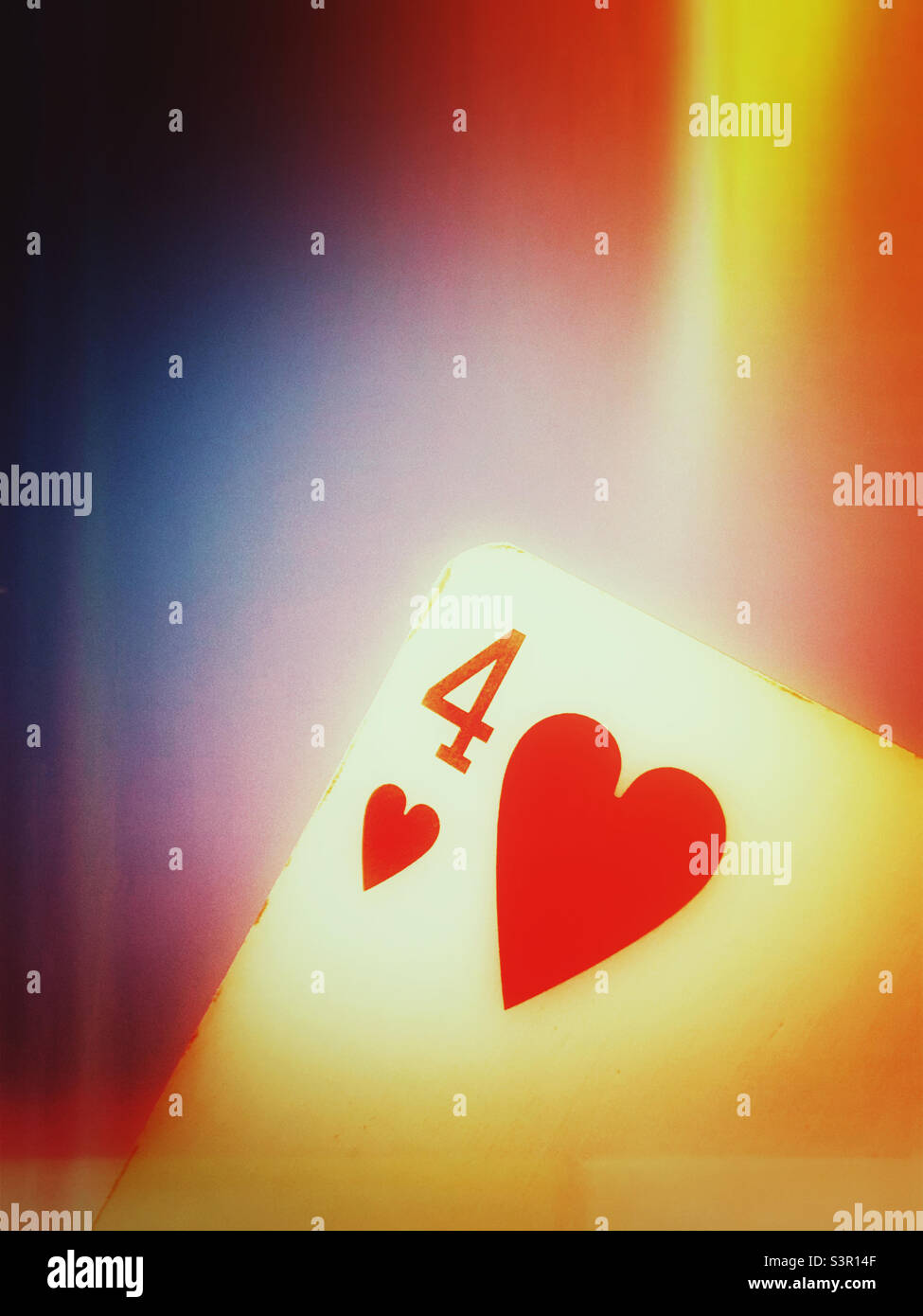 An abstract photograph of a four of hearts playing card Stock Photo