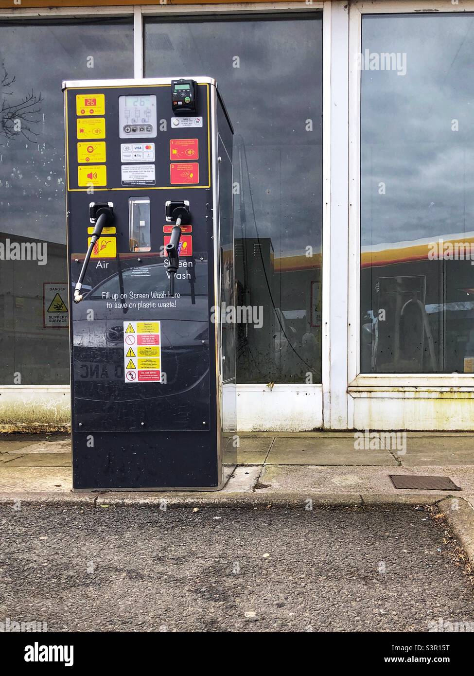 Air and water dispenser on garage forecourt Stock Photo