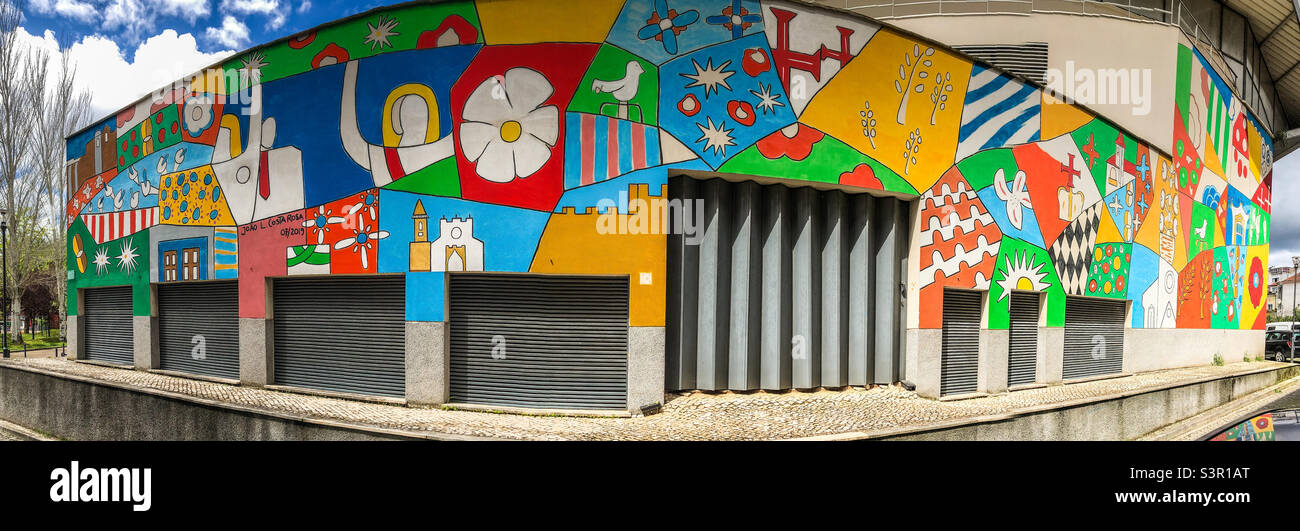 Panoramic image of a mural by Joao L Costa Rosa, celebrating the 2019 Festa Dos Tabuleiros on the Pavilhão Municipal Cidade de Tomar, Portugal Stock Photo
