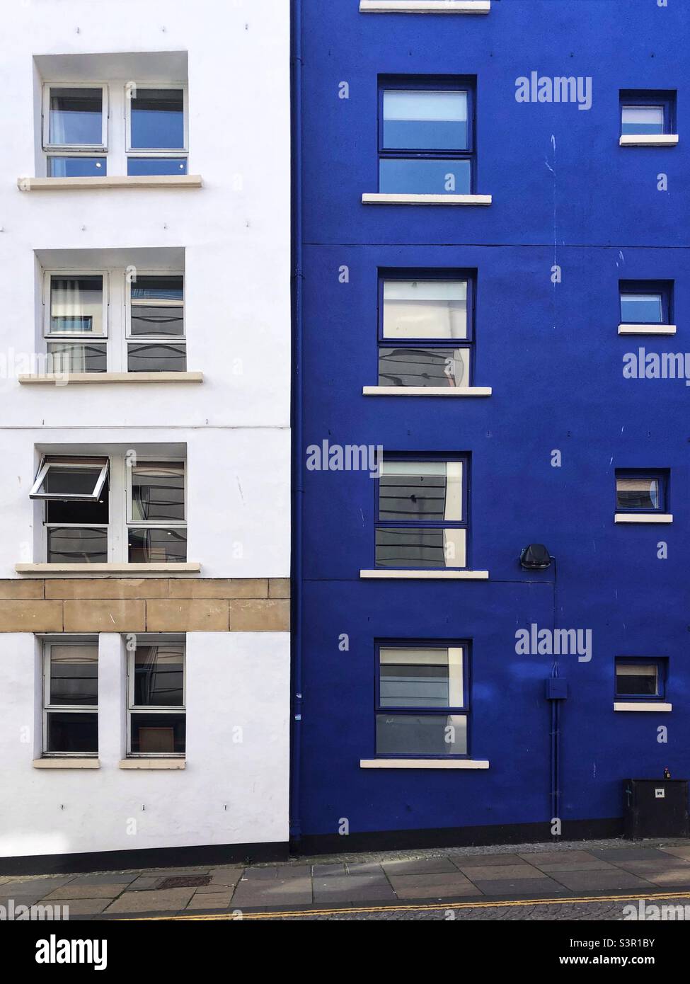 Blue and white apartments side by side - Smartphone Captured Stock Image