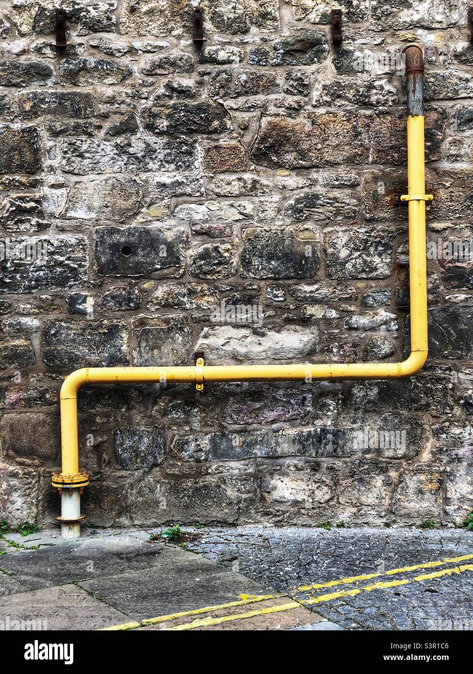 Yellow Drainpipe - Smartphone Captured Stock Image