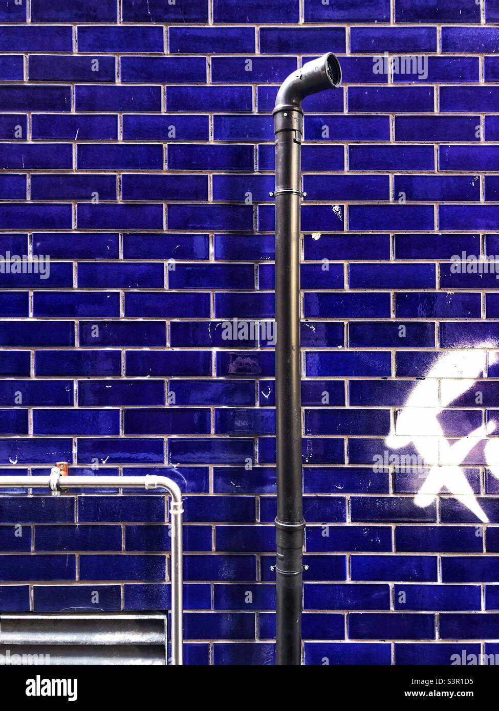 Ventilation pipe on an external blue tile wall Stock Photo - Alamy - Pipe Tile Wall Treatment Decor