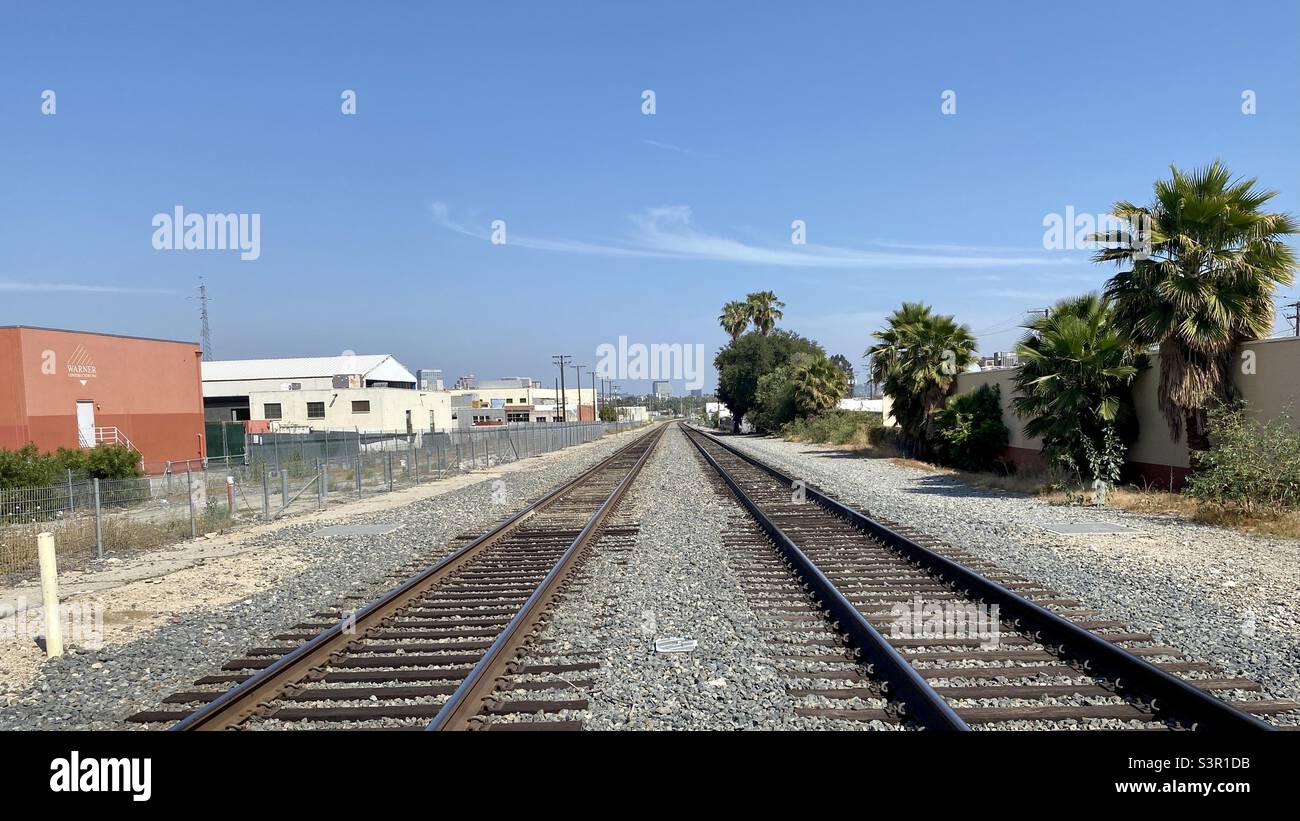 LOS ANGELES, CA, MAY 2021: view along railway tracks at a road crossing in Glendale - Smartphone Captured Stock Image
