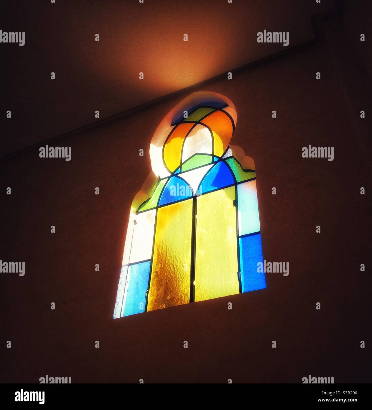 Light shining through stained glass hires stock photography and images
