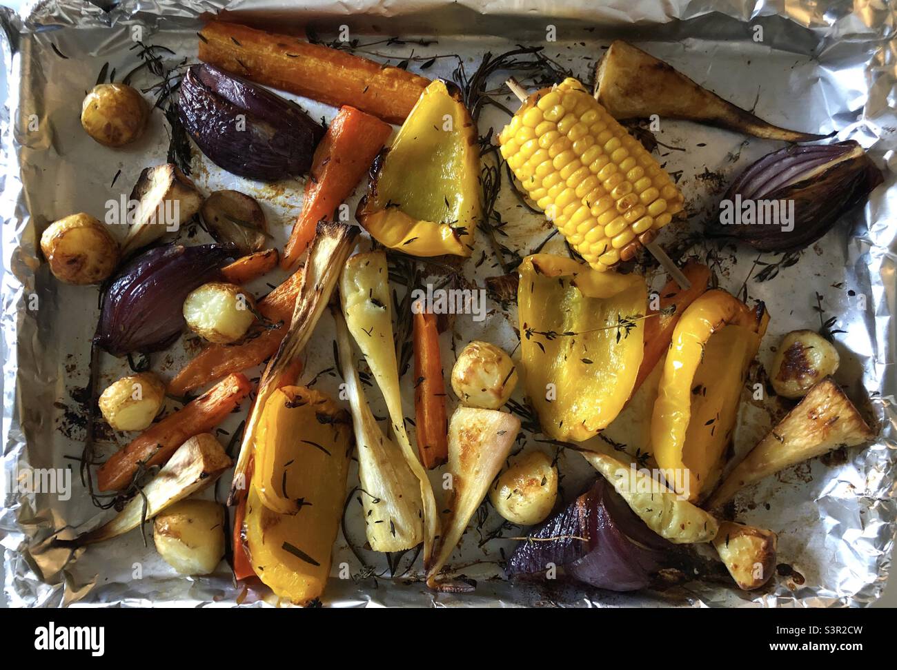 Roast vegetables baked in a roasting tin - Smartphone Captured Stock Image Roast vegetables baked in a roasting tin - Smartphone Captured Stock Image