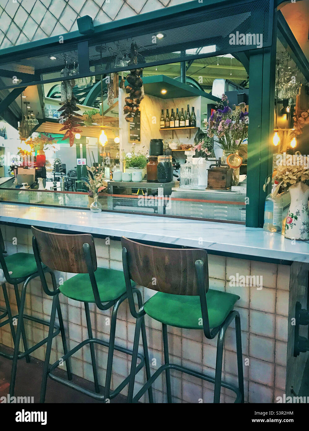 A typical French cafe inside a fruit and vegetable market in central Paris - Smartphone Captured Stock Image