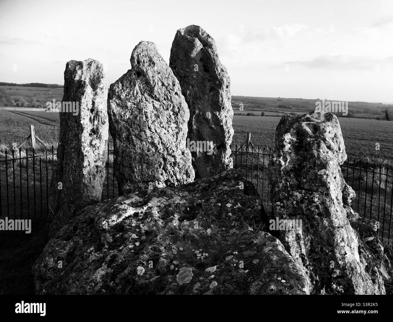 The‘Whispering Knights’ prehistoric stones at the Rollright Stones appear to confer with each other. Stock Photo