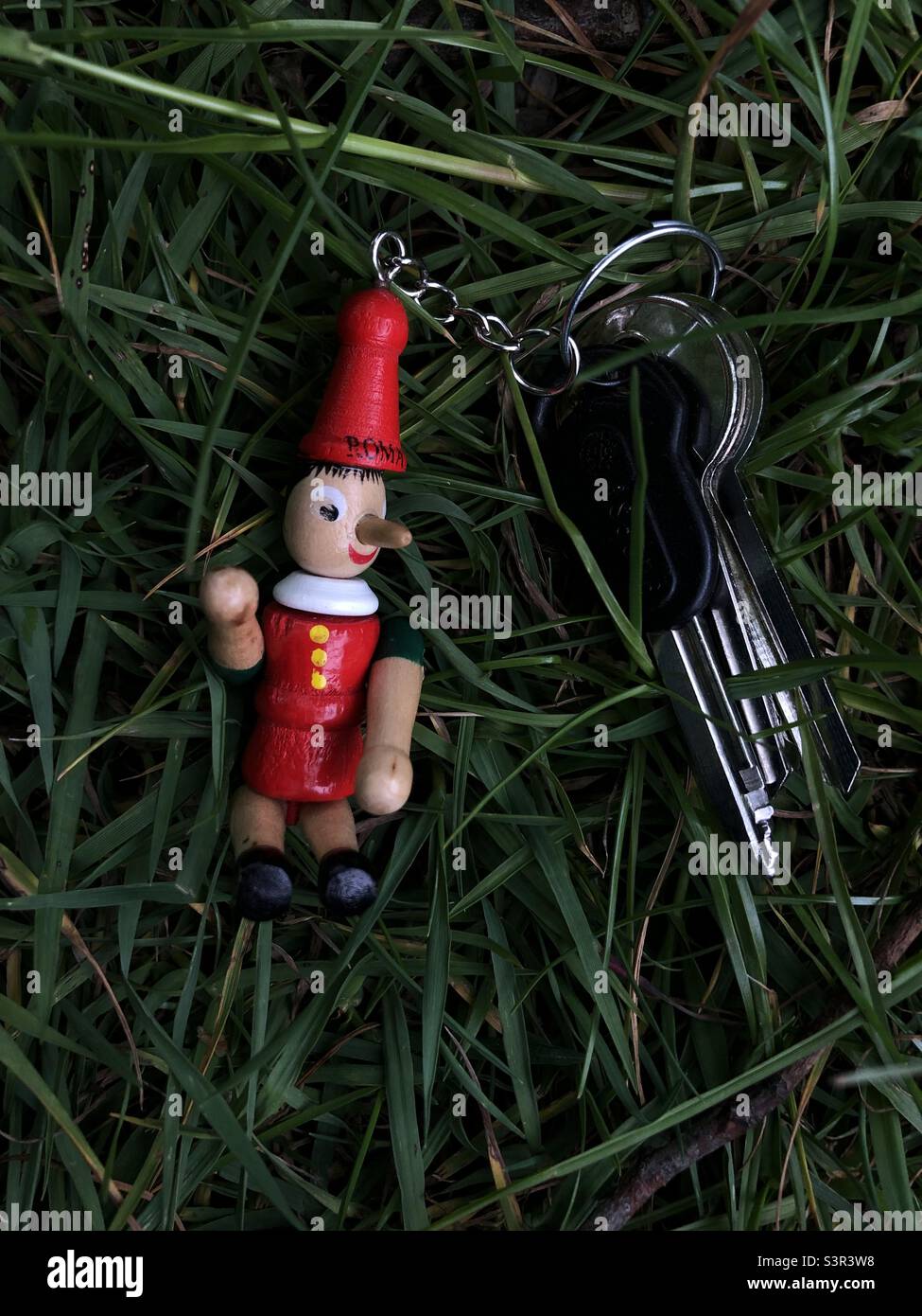 Key holder in the shape of character Pinocchio Stock Photo