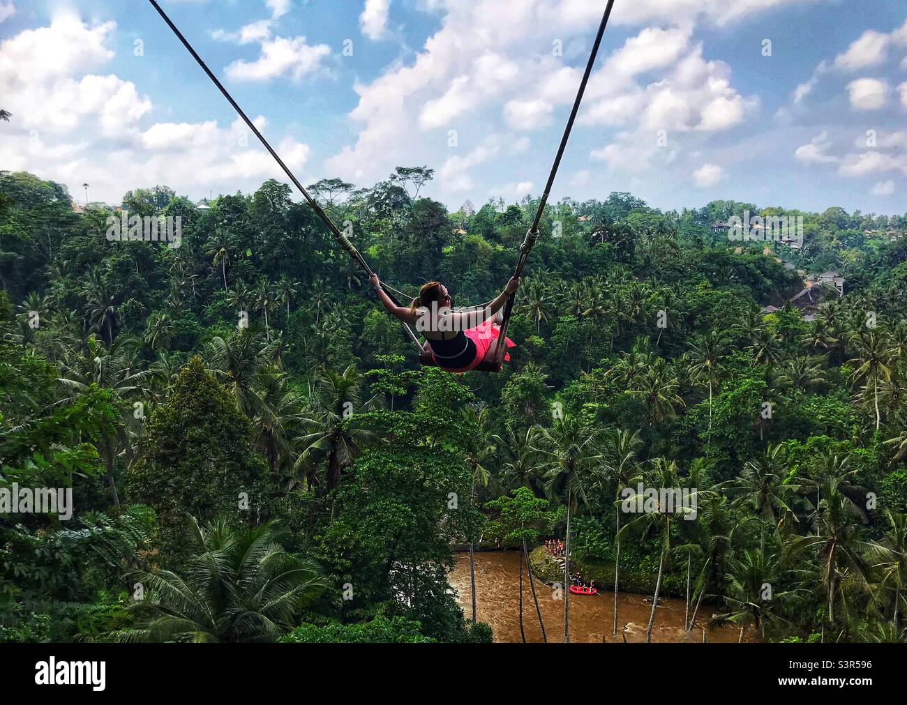 Woman on rope swing hi-res stock photography and images - Alamy