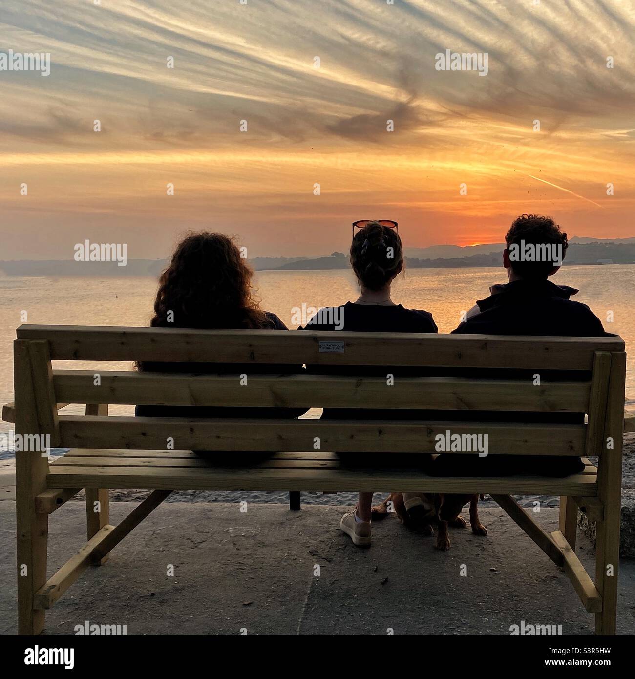 Watching the setting sun by the sea - Smartphone Captured Stock Image