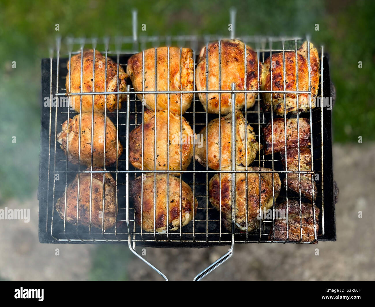 Fried chicken kebab on the grill in the grill - Smartphone Captured Stock Image