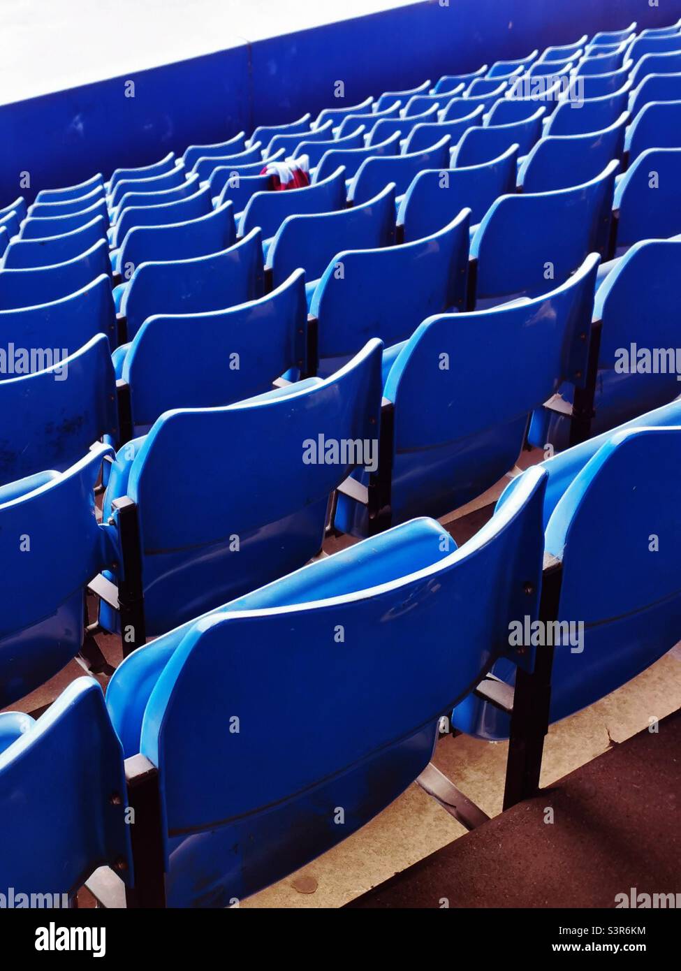 blue rows of chairs on stadium Stock Photo