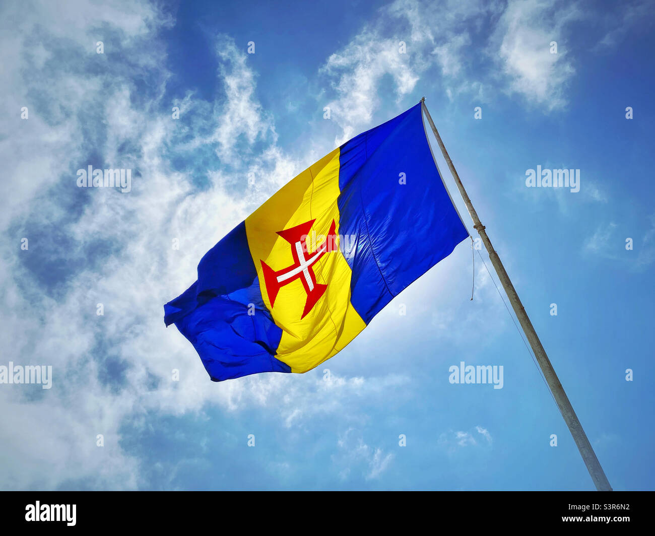 The flag of Madeira - an autonomous region of Portugal. The blue represents the environment & nobility. The gold represents the climate & wealth. The Red Cross is The Cross of Christ. ©️ COLIN HOSKINS - Smartphone Captured Stock Image