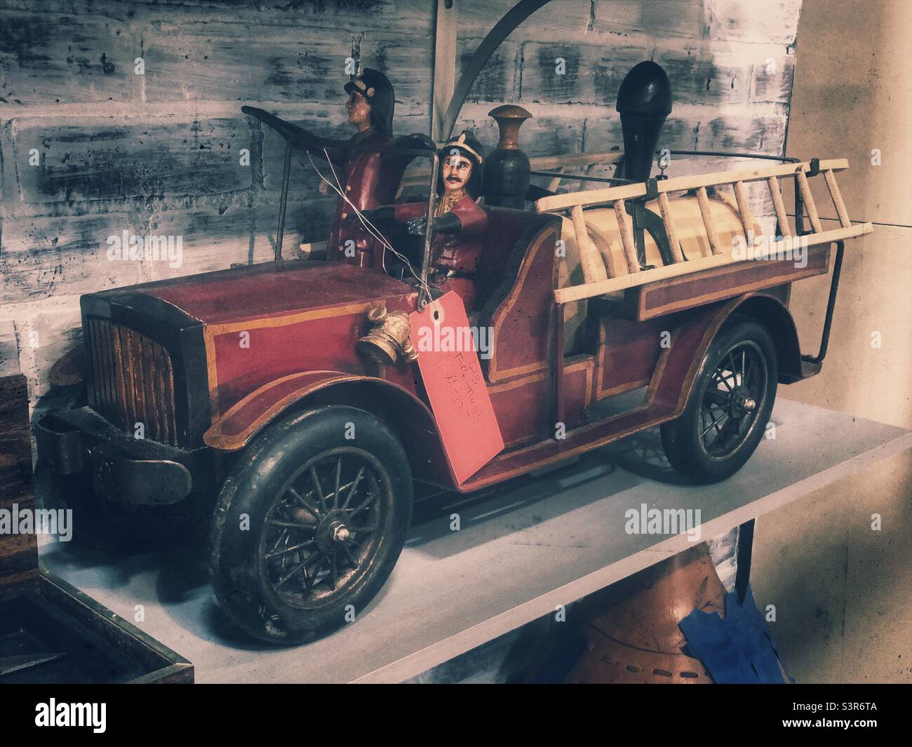 Vintage tin fire truck toy on display at antique mall Stock Photo