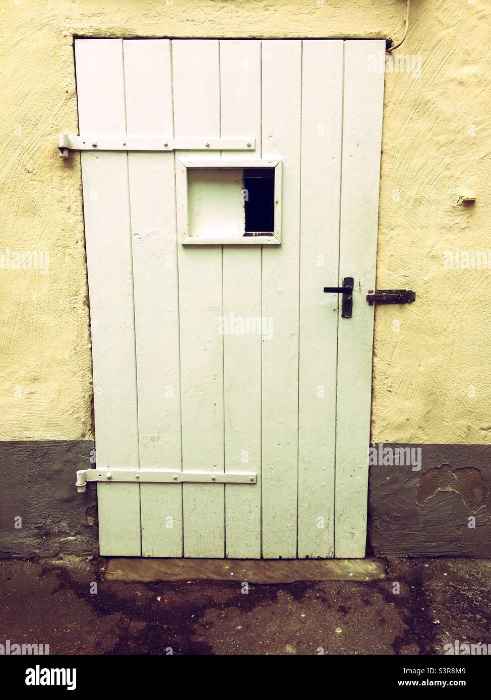 Closed old wooden door with window - Smartphone Captured Stock Image