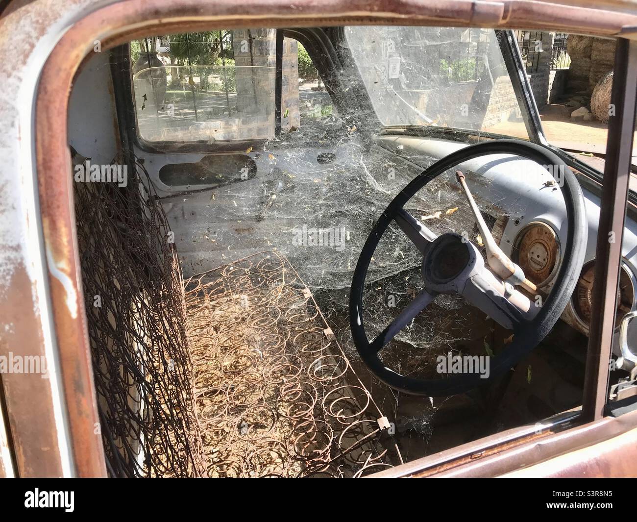 Dilapidated remains of the cab of a pick-up truck. - Smartphone Captured Stock Image
