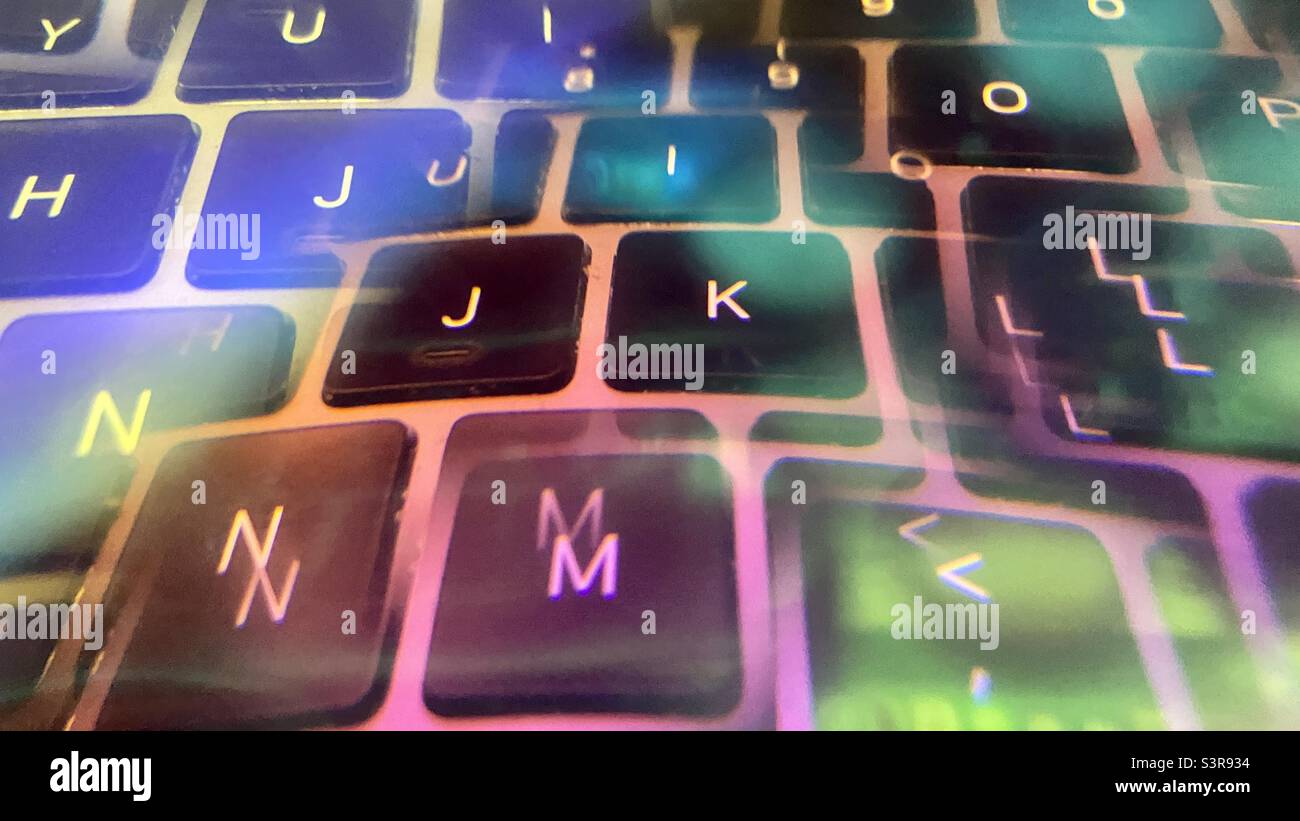 Colorful abstract pattern created with prism in front of camera lens. Letters on a computer keyboard with multiple reflections - Smartphone Captured Stock Image