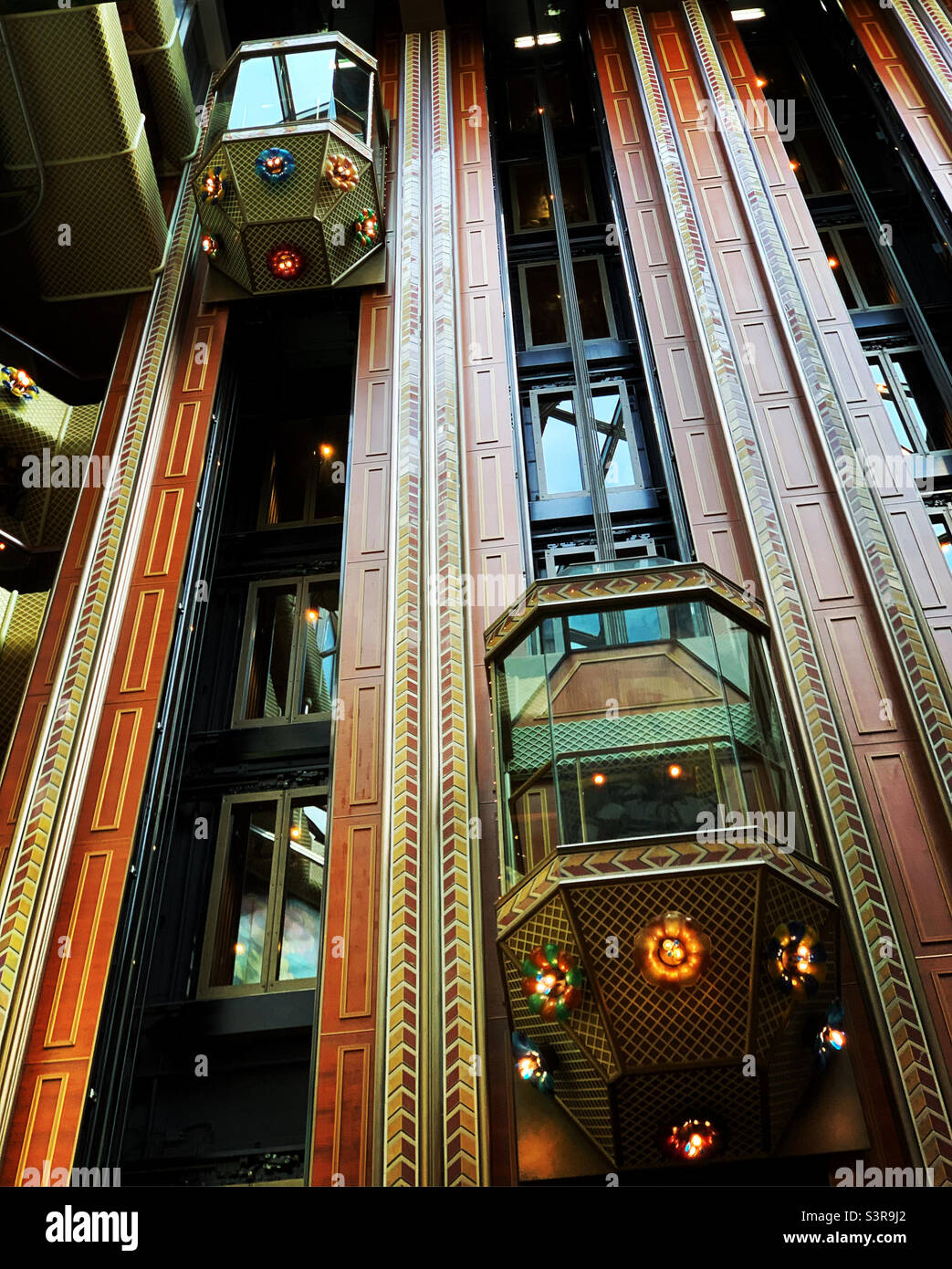 Glass elevators in the atrium of the Carnival Conquest cruise ship, in