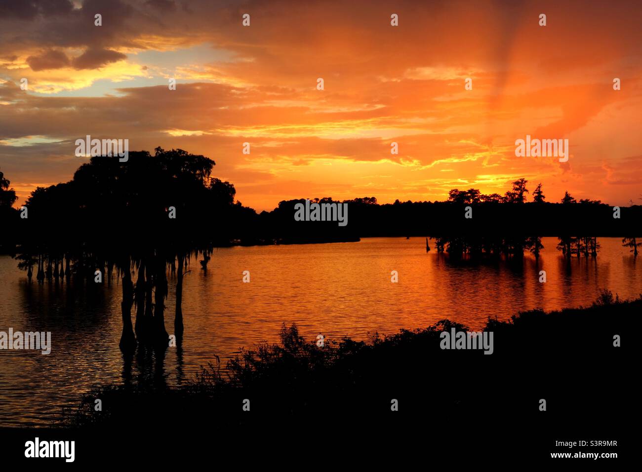 Sunset over piney z lake in Tallahassee Florida Stock Photo