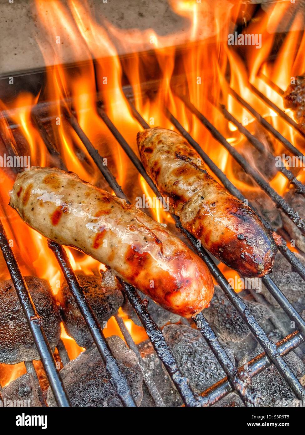 Sizzling Sausage on the BBQ Stock Photo Alamy