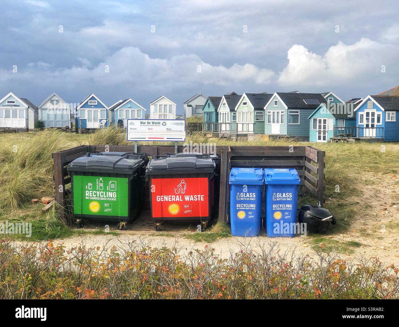 Recycle rubbish bins in front of beach huts at Mudeford sandbanks, Dorset,  United Kingdom Stock Photo - Alamy
