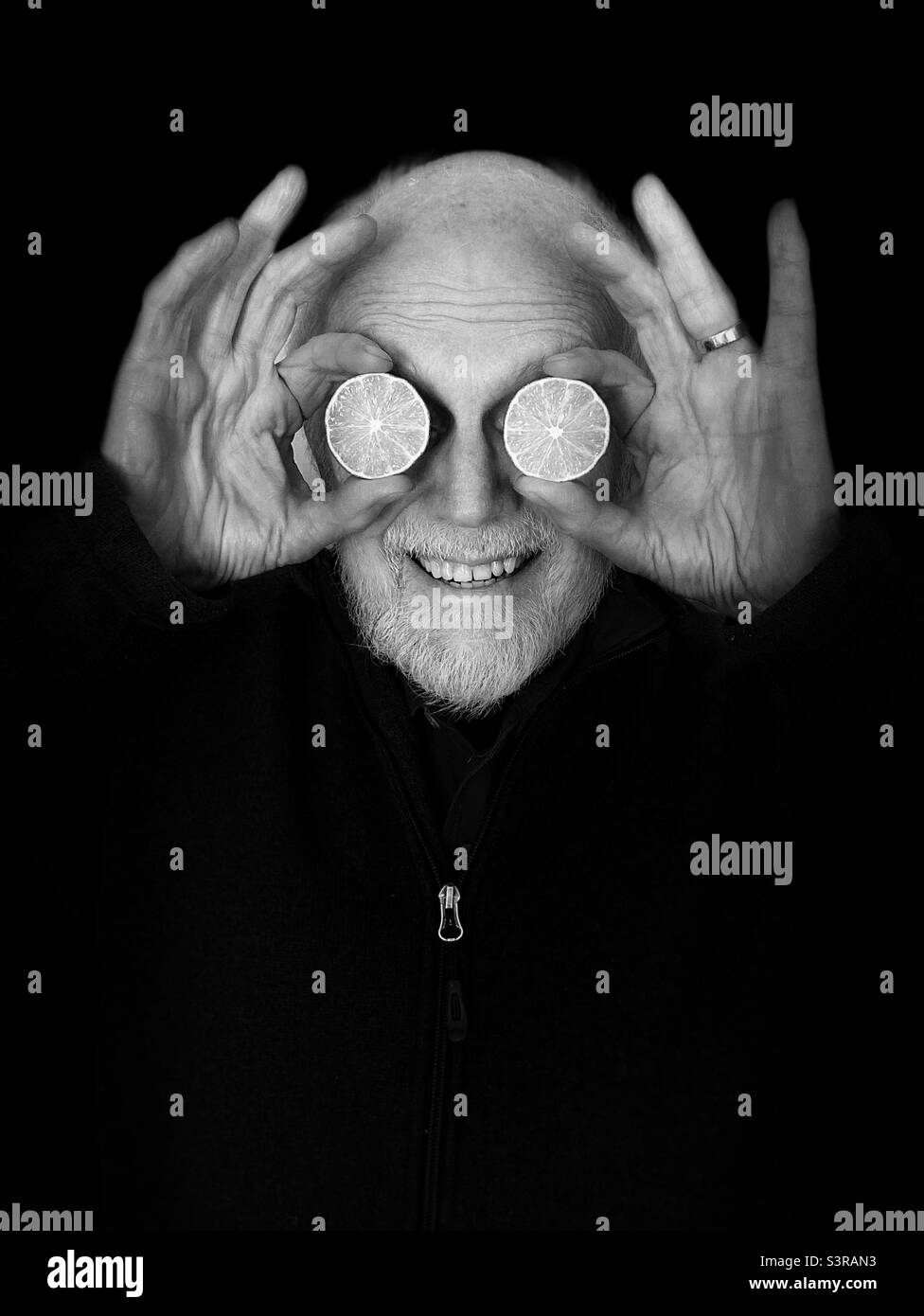 Man with beard and cut limes for eyes, in black snd white - Smartphone Captured Stock Image