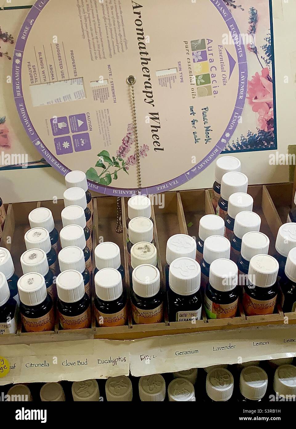 Small Bottles of Essential Oils in Store Display - Smartphone Captured Stock Image