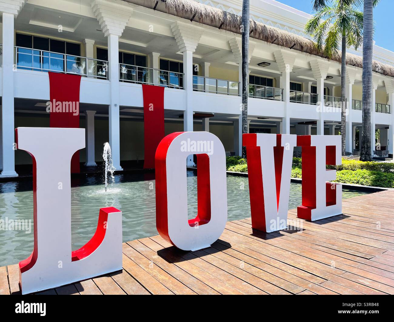 “LOVE” in large letters on a bridge - Smartphone Captured Stock Image