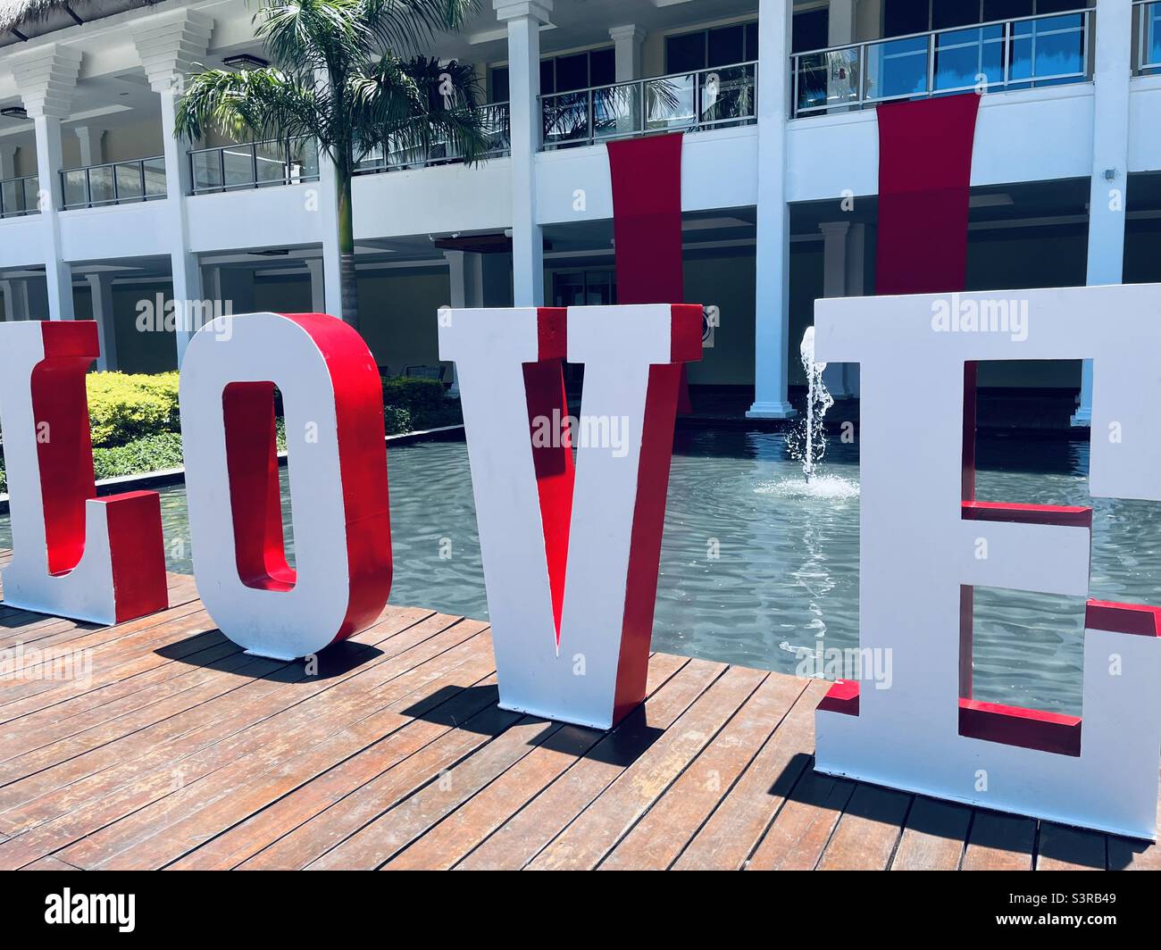 LOVE in large letters on a bridge - Smartphone Captured Stock Image