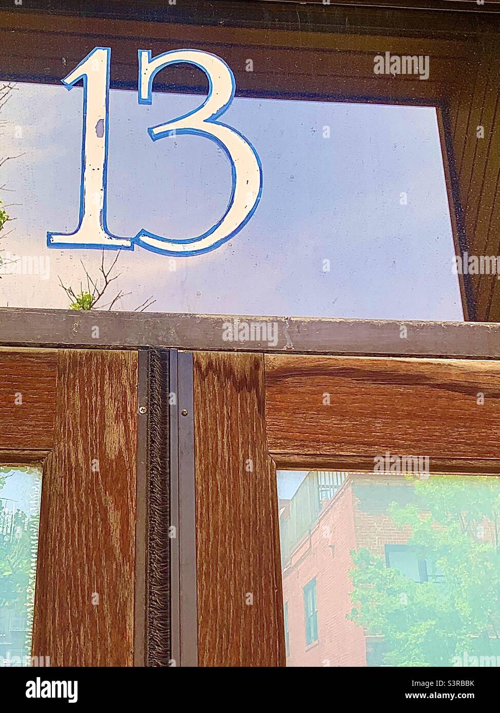 Antique Brown Wooden Doors with Number 13 on Transom - Smartphone Captured Stock Image