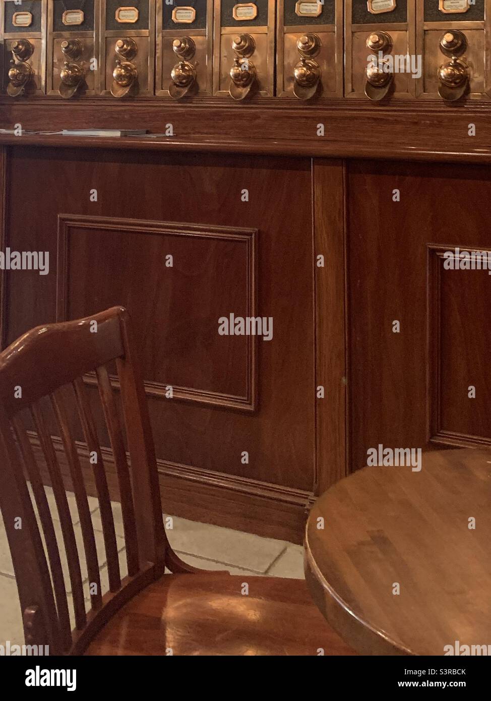 Mahogany Table and Chair in front of Mahogany Bar - Smartphone Captured Stock Image