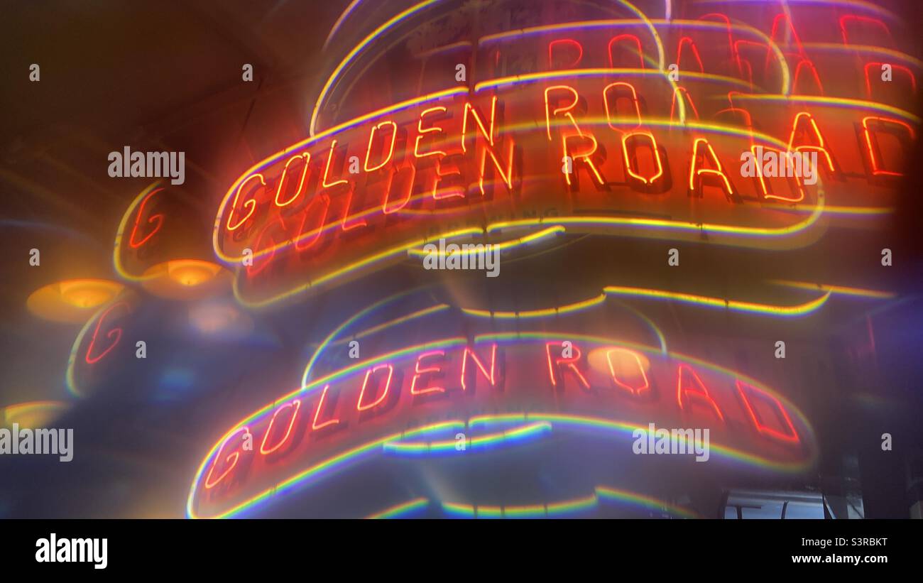 LOS ANGELES, CA, AUG 2021: abstract pattern created with prism viewing Golden Road Brewery's neon sign in Downtown at night. - Smartphone Captured Stock Image