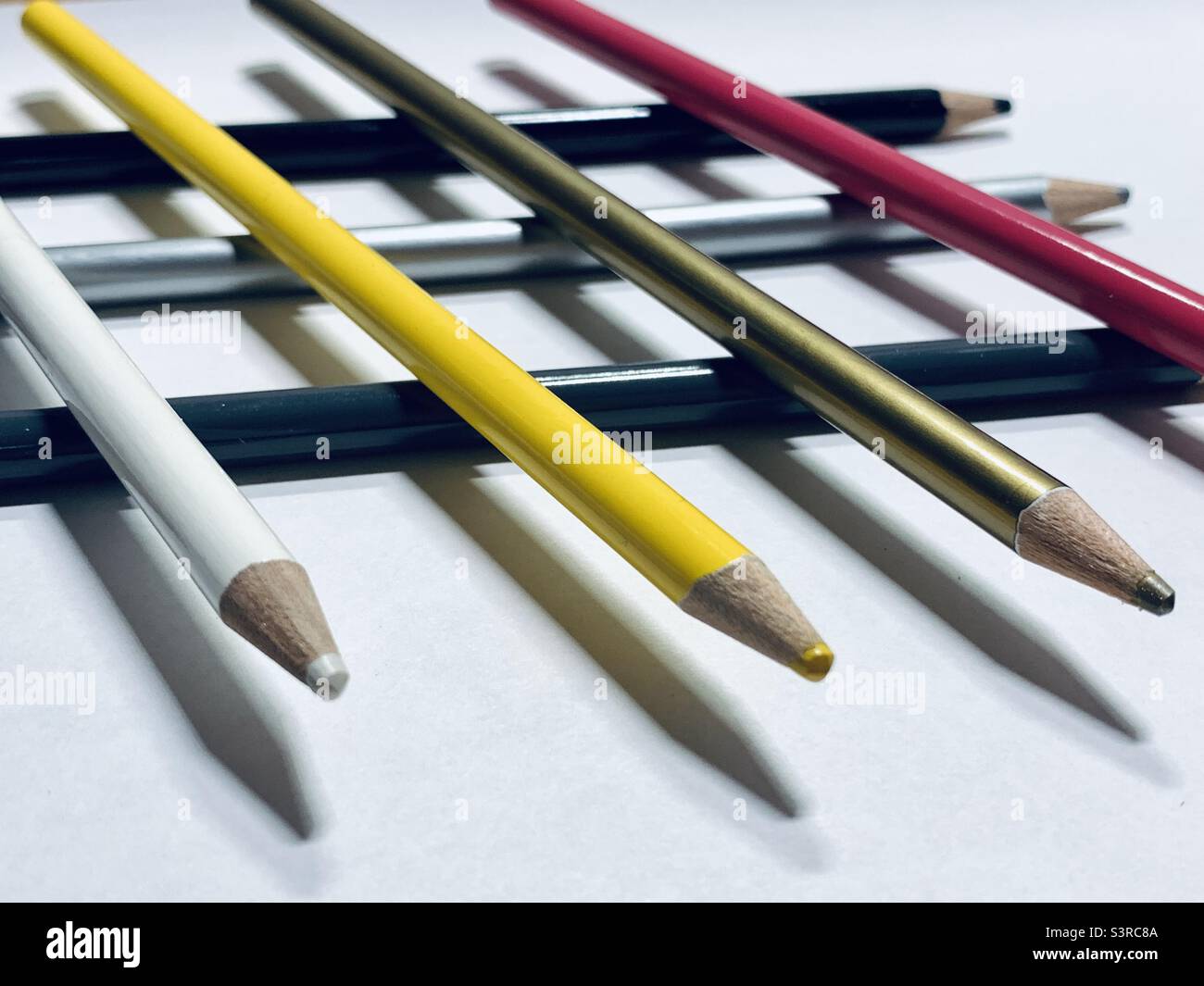 Colored pencils on piled up Stock Photo