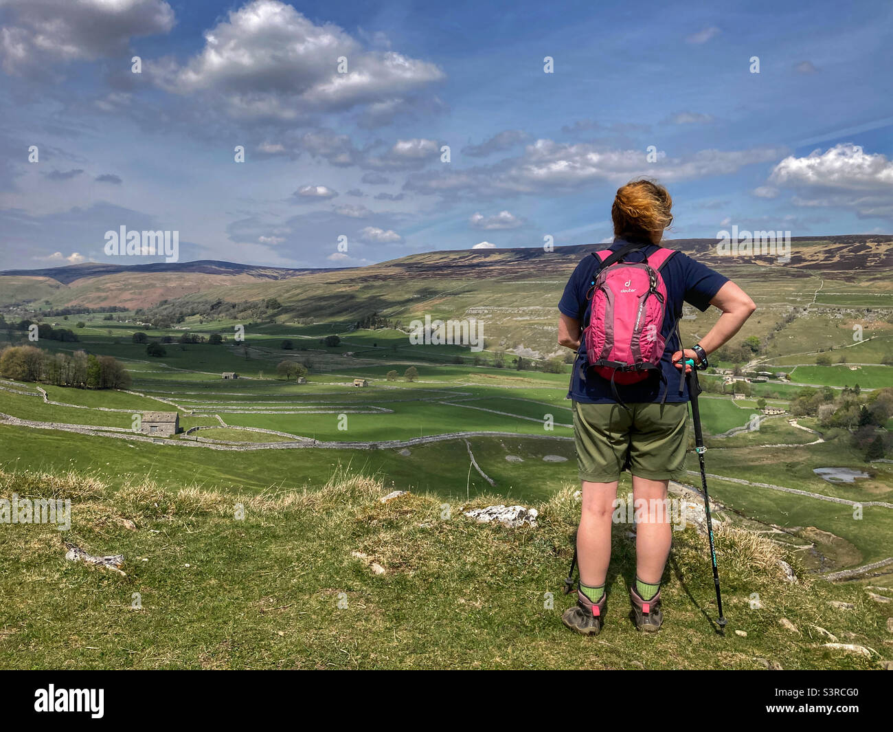 Woman hiker enjoying the view of Littondale Yorkshire Dales - Smartphone Captured Stock Image