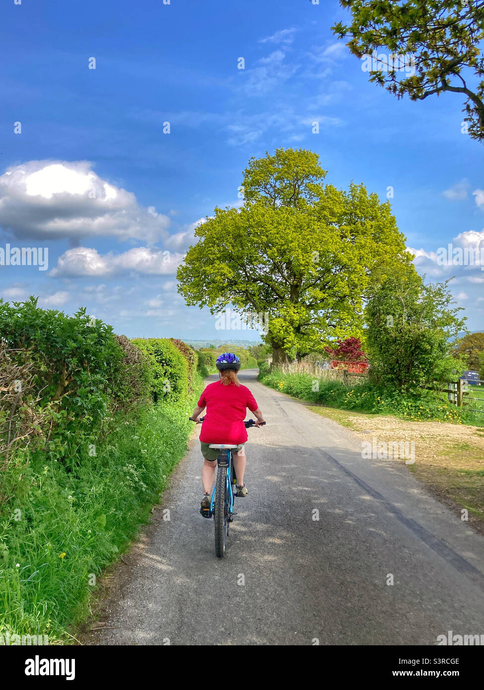 Woman cycling in the Yorkshire Dales Stock Photo