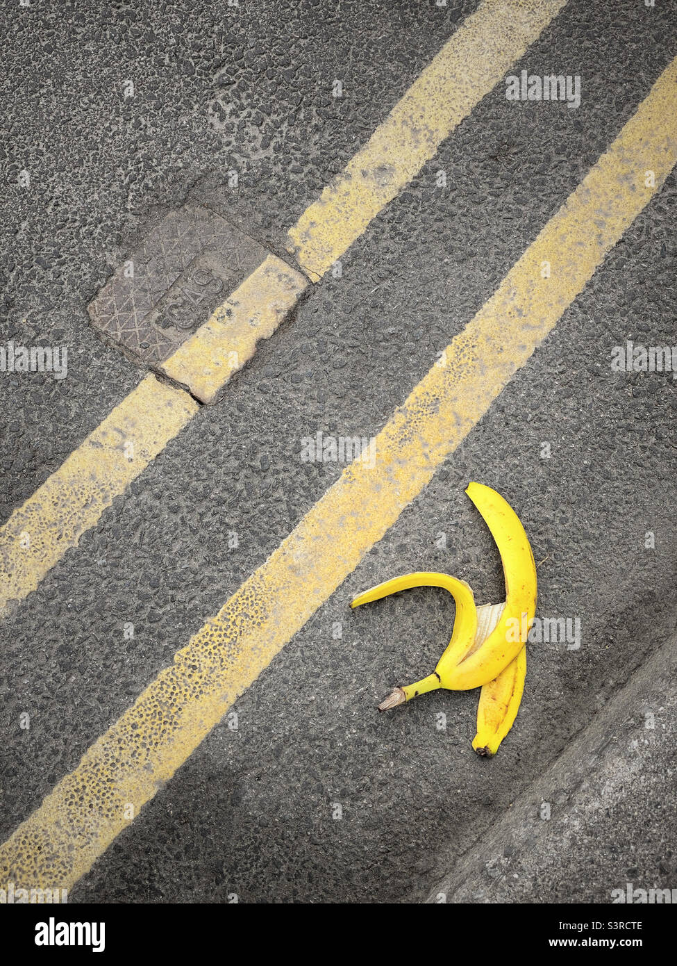 A discarded banana peel - beware - danger! Don’t look stupid or cause yourself problems. Keep your eyes peeled for hazards! Photo ©️ COLIN HOSKINS. - Smartphone Captured Stock Image