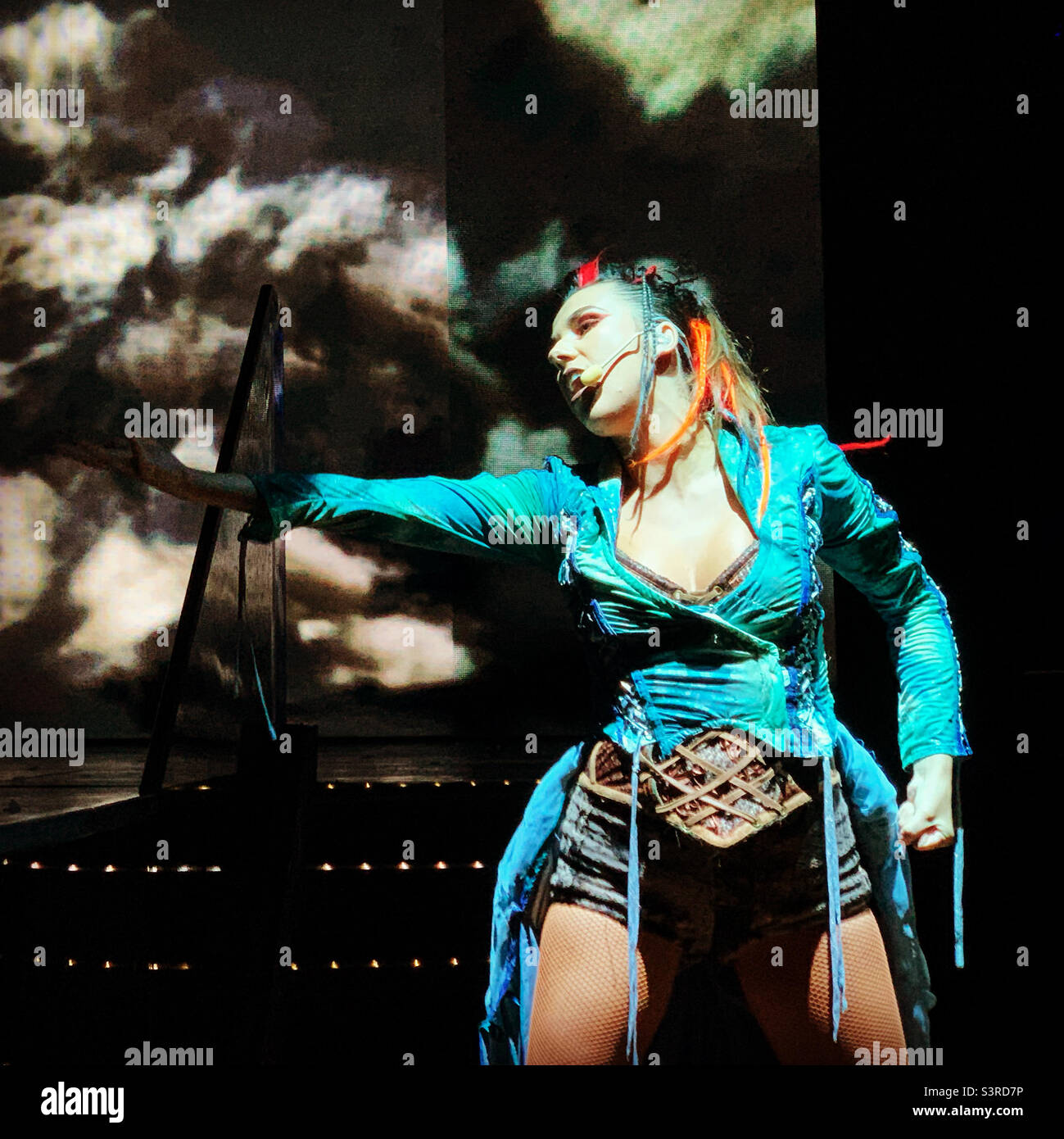 March, 2022, a woman performs in Playlist Productions’ Epic Rock show on board the Carnival Conquest during a cruise from Miami, Florida to the Bahamas - Smartphone Captured Stock Image