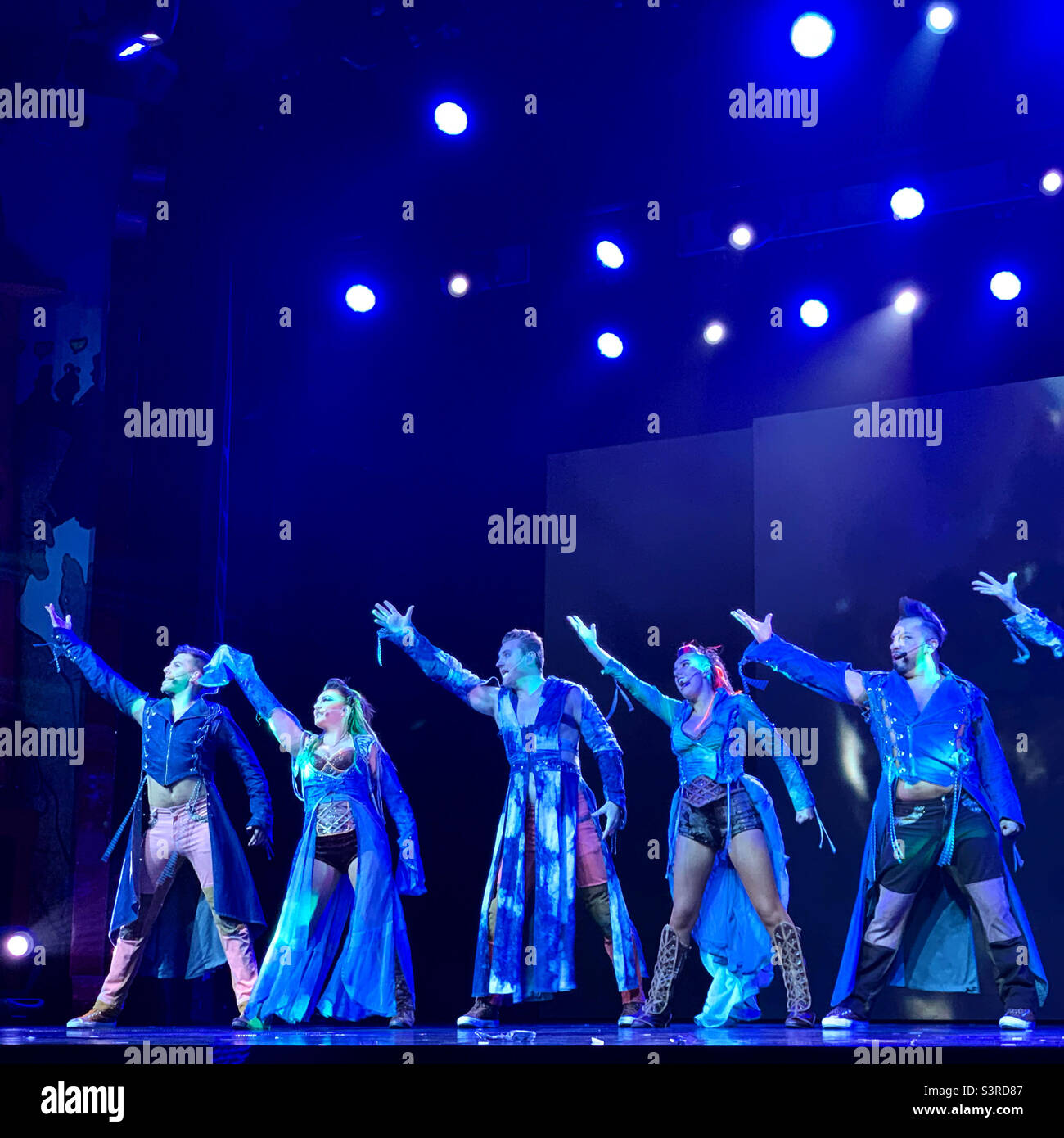 March, 2022, performers in Playlist Productions’ Epic Rock show on board the Carnival Conquest during a cruise from Miami, Florida to the Bahamas - Smartphone Captured Stock Image