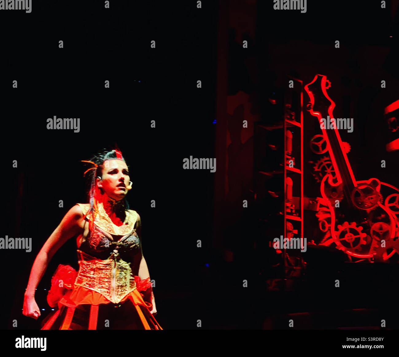 March, 2022, a woman performing in Playlist Productions’ Epic Rock show on board the Carnival Conquest during a cruise from Miami, Florida to the Bahamas - Smartphone Captured Stock Image