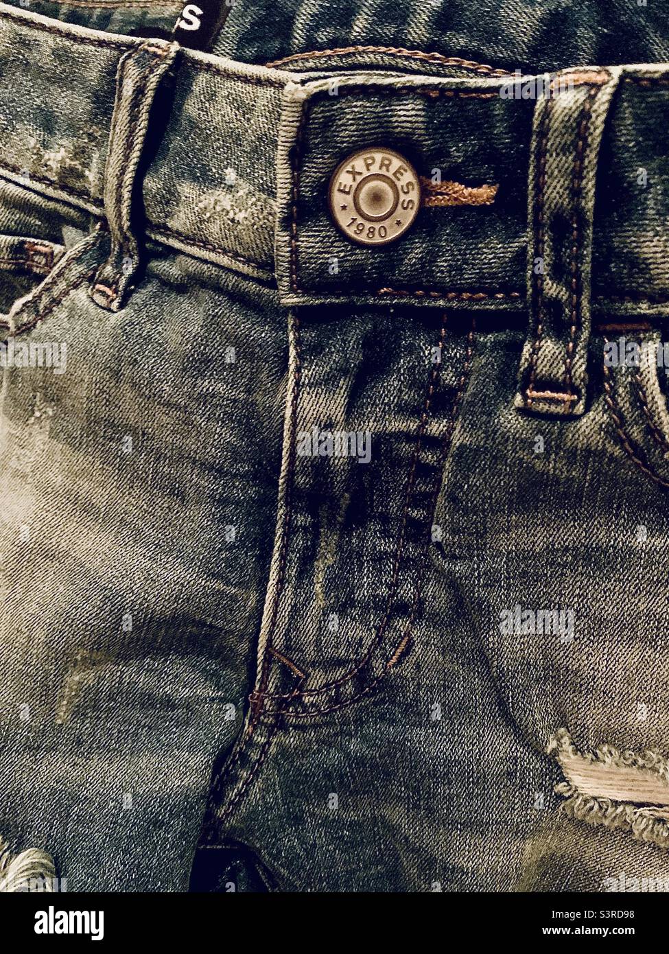 Worn in blue jeans Stock Photo
