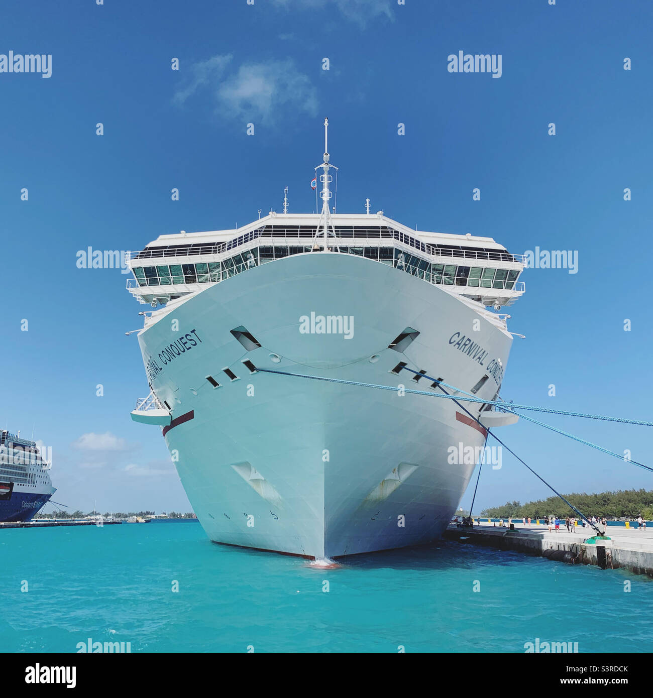 March, 2022, Carnival Conquest in port in Nassau, Bahamas, during a three-day cruise from Miami, Florida, United States - Smartphone Captured Stock Image