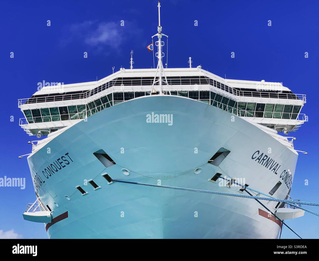 March, 2022, the bow of the Carnival Conquest, in port in Nassau, Bahamas during a cruise from Miami, Florida - Smartphone Captured Stock Image