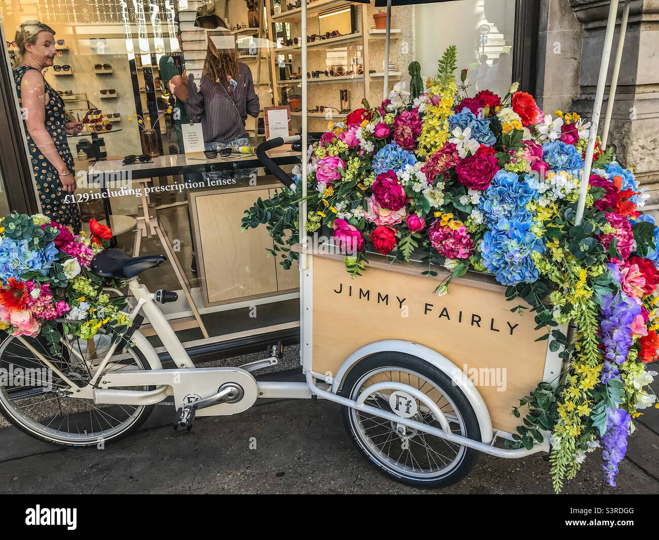 Floral adorned bicycle Stock Photo